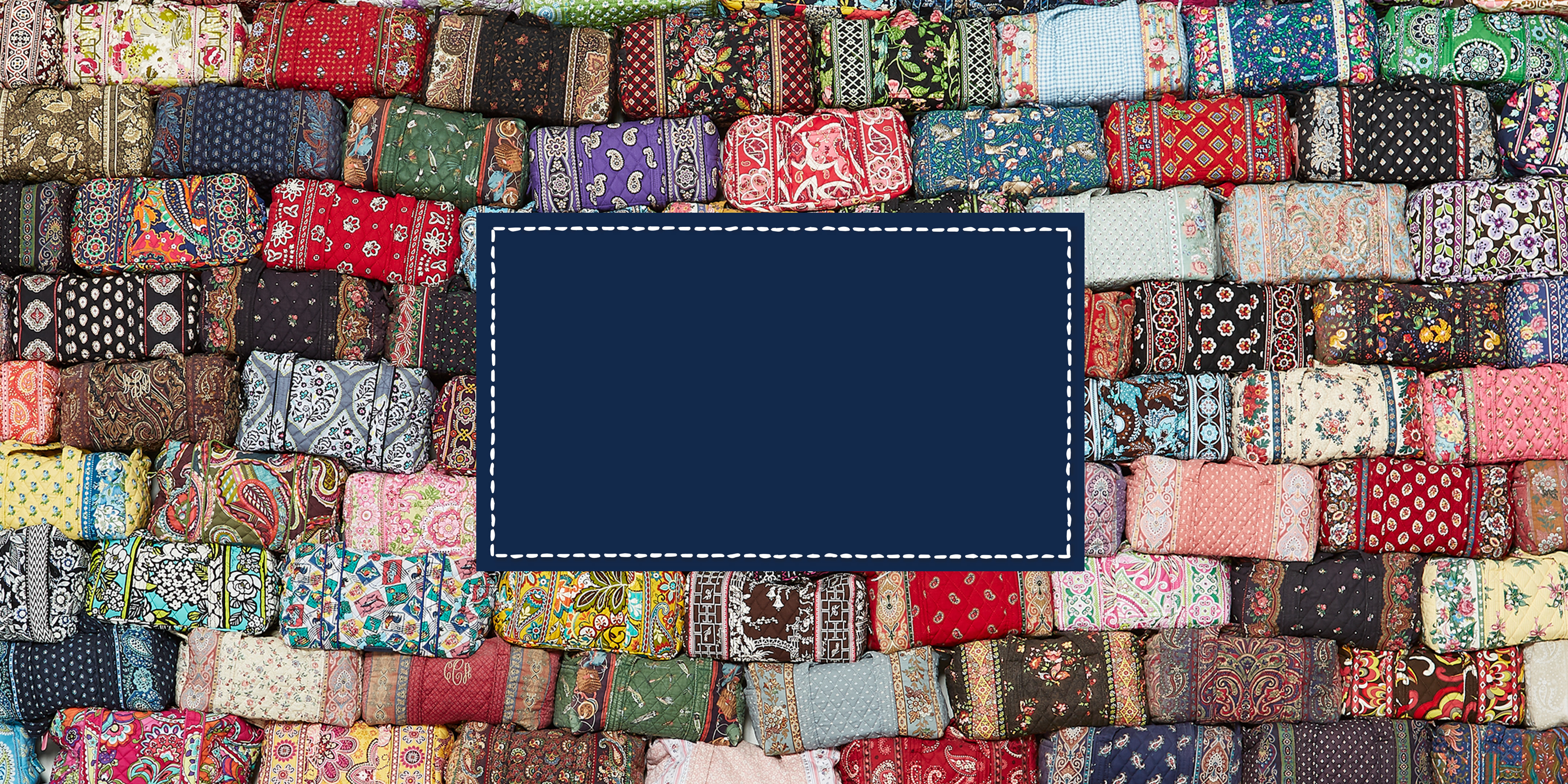 A patchwork of multicolored patterned Vera Bradley duffle bags